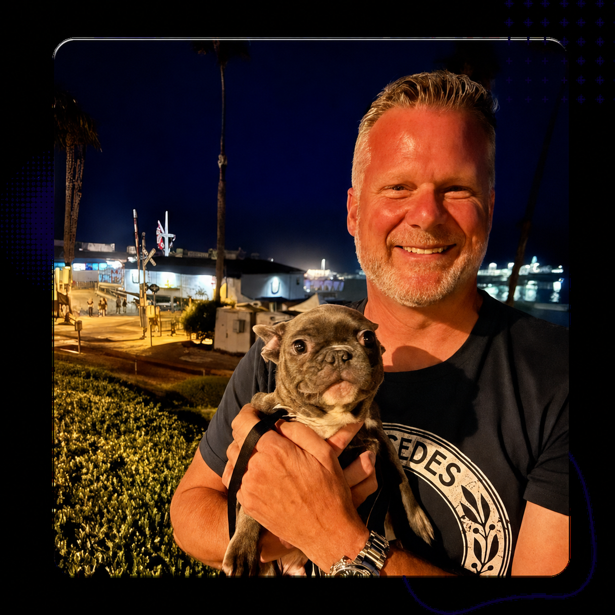 Ed with his Frenchie by the marina